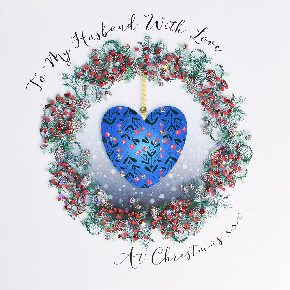 Blue heart Christmas card for husband by Wendy Jones-Blackett, featuring festive design and heartfelt message, from Cornucopia Home and Gift.