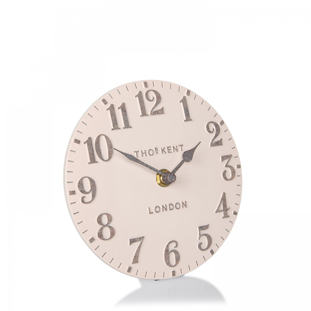 Shy pink 6-foot Arabic mantel clock by Cornucopia Home and Gift, showcasing elegant design and Arabic numerals on a decorative clock face.