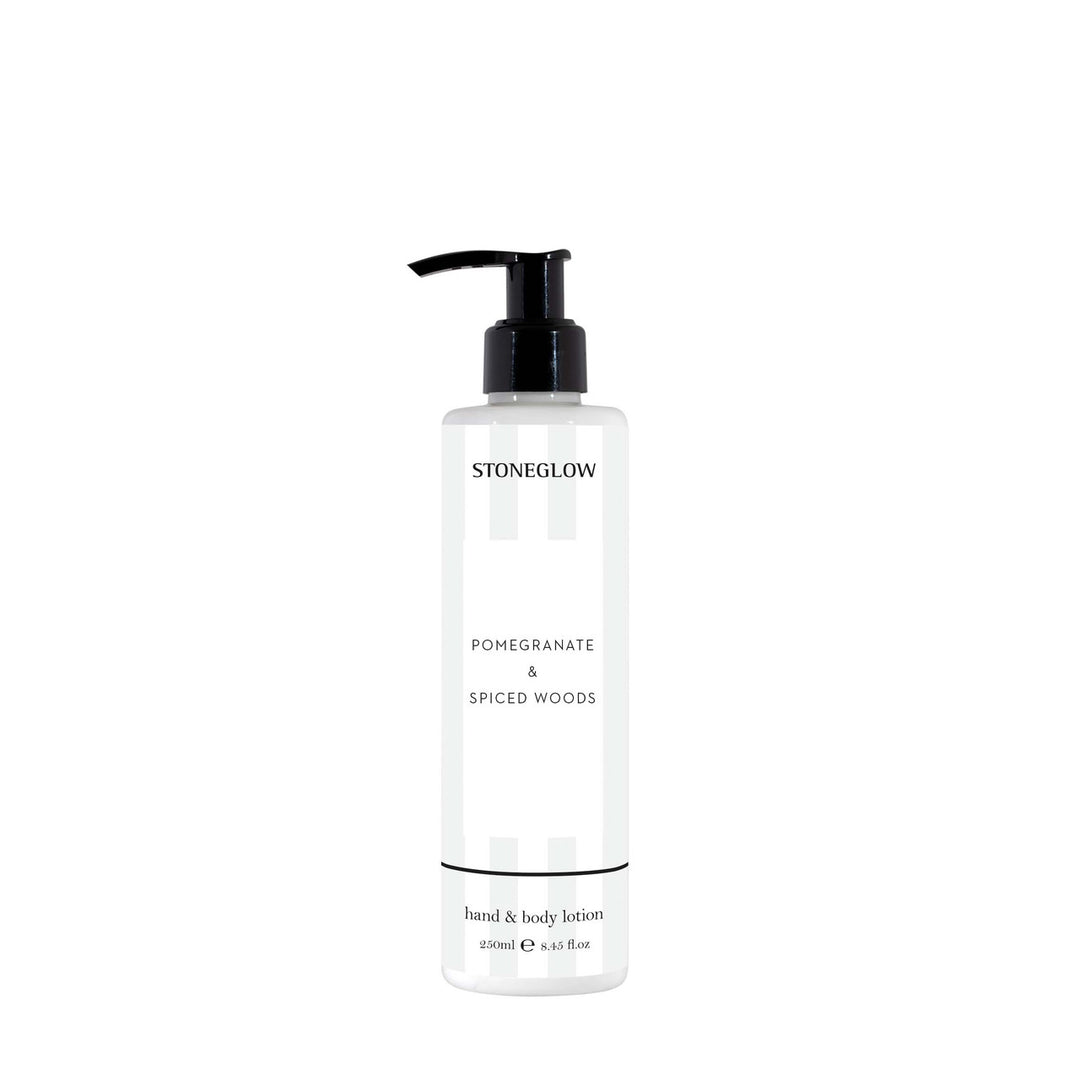 Stoneglow Modern Classics Classic Pom &amp; Spiced Woods Lotion bottle with elegant label and pump dispenser.