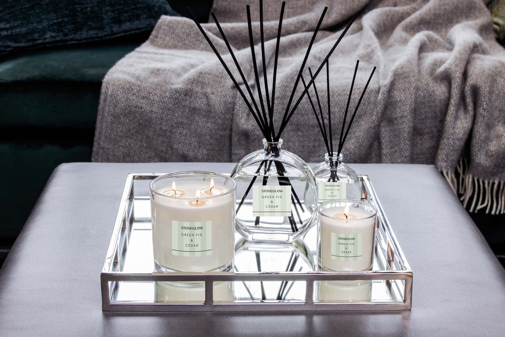 Stoneglow Modern Classics Green Fig and Cedar reed diffuser in a stylish glass bottle, displayed in a luxurious home setting.