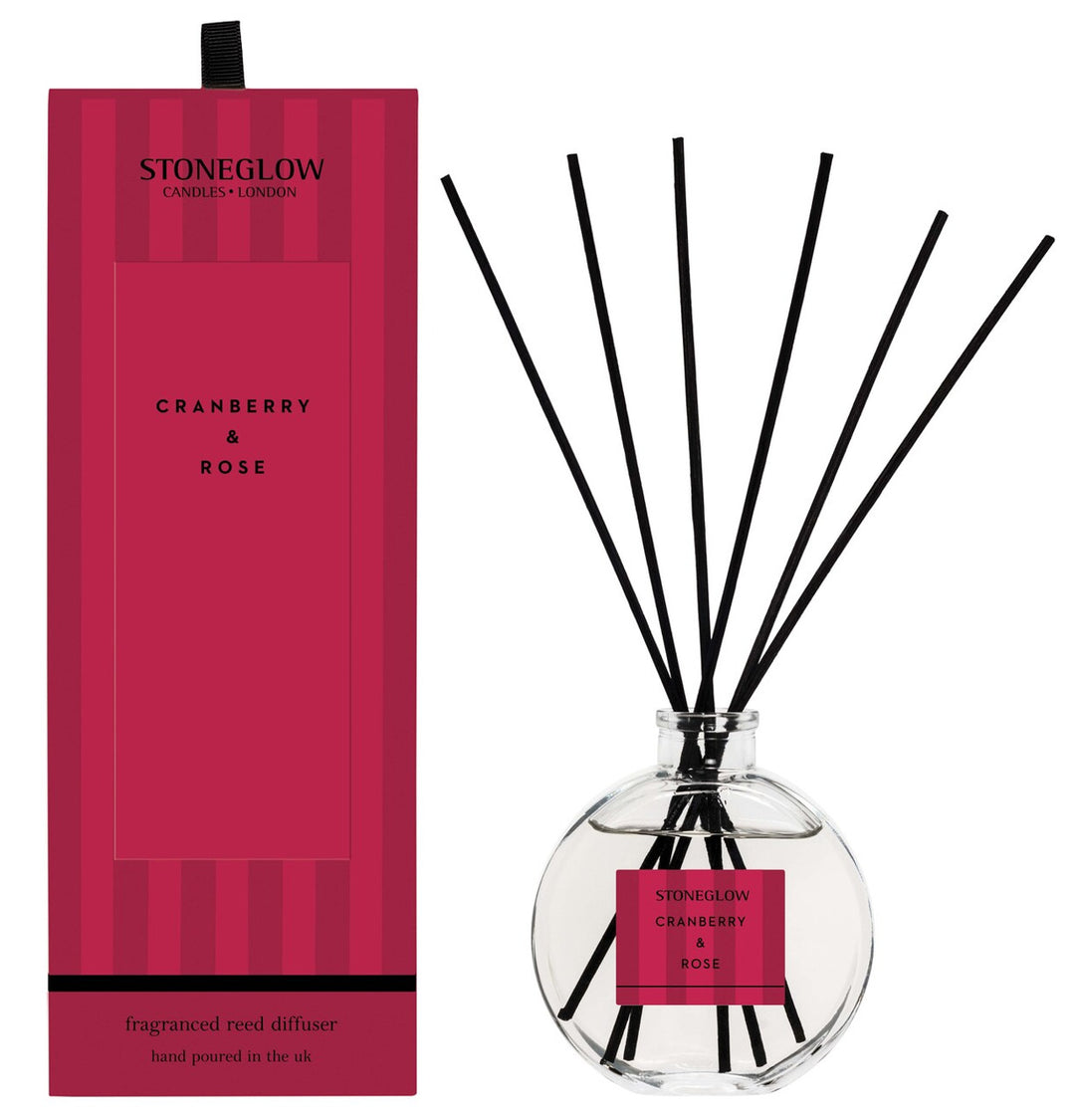 Stoneglow Modern Classics Cranberry & Rose reed diffuser with a sleek glass bottle and reed sticks for home fragrance.