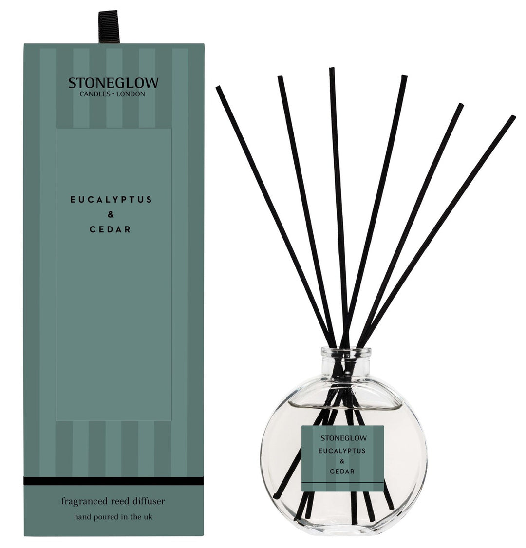Stoneglow Modern Classics Eucalyptus & Cedar scented reed diffuser with a sleek glass bottle and natural reed sticks.