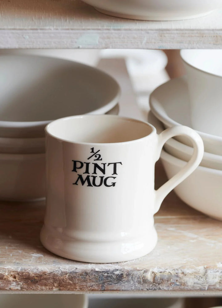Emma Bridgewater Black Toast ½ Pint Mug with black toast pattern, ceramic cup featuring classic design and sturdy handle.