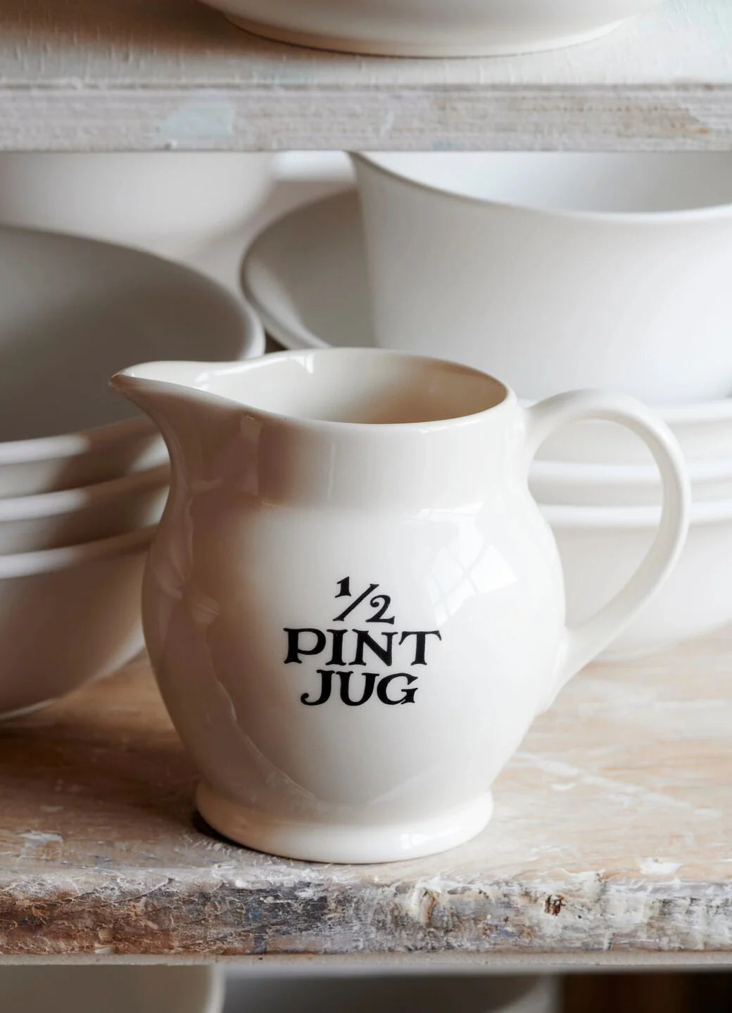 Emma Bridgewater Black Toast ½ Pint ceramic jug with black and white toast pattern, ideal for kitchen or table use.