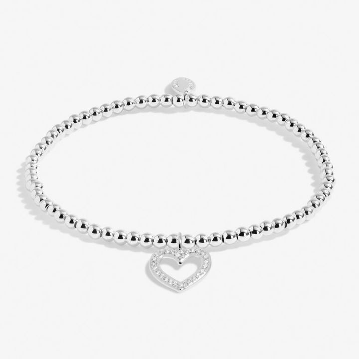 Joma Jewellery Little Sister bracelet featuring a delicate silver chain and heart charm, perfect for gifting.