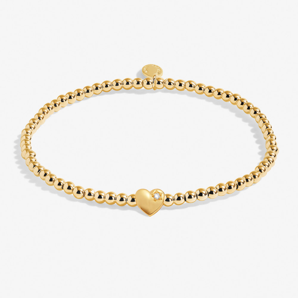 Joma Jewellery A Little Happy 18th bracelet with charm and beads, silver-tone jewelry on a neutral background