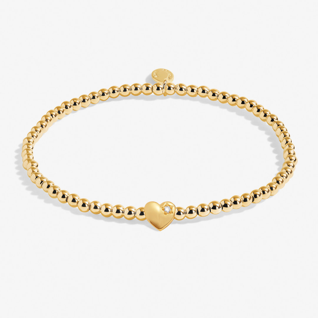 Joma Jewellery A Little Happy 18th bracelet with charm and beads, silver-tone jewelry on a neutral background
