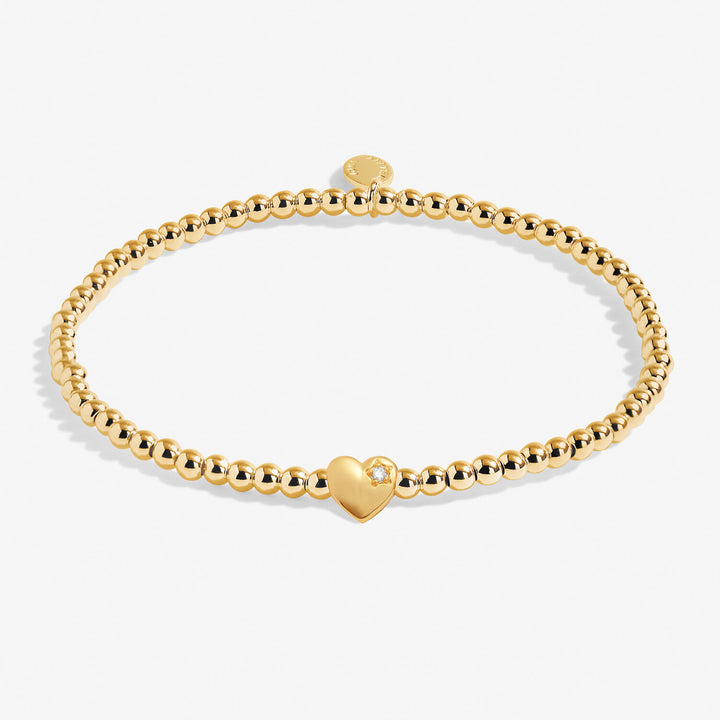 Joma Jewellery A Little Happy 18th bracelet with charm and beads, silver-tone jewelry on a neutral background