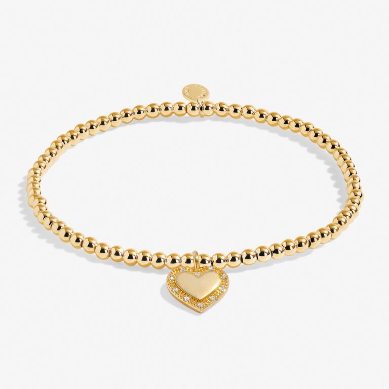 Joma Jewellery A Little Happy 16th Birthday bracelet with a silver charm and pink bead on a delicate chain.