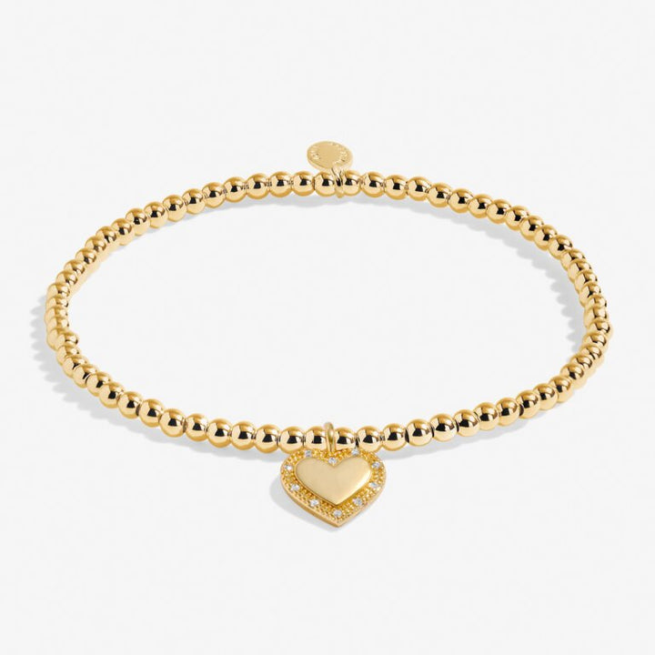 Joma Jewellery A Little Happy 16th Birthday bracelet with a silver charm and pink bead on a delicate chain.