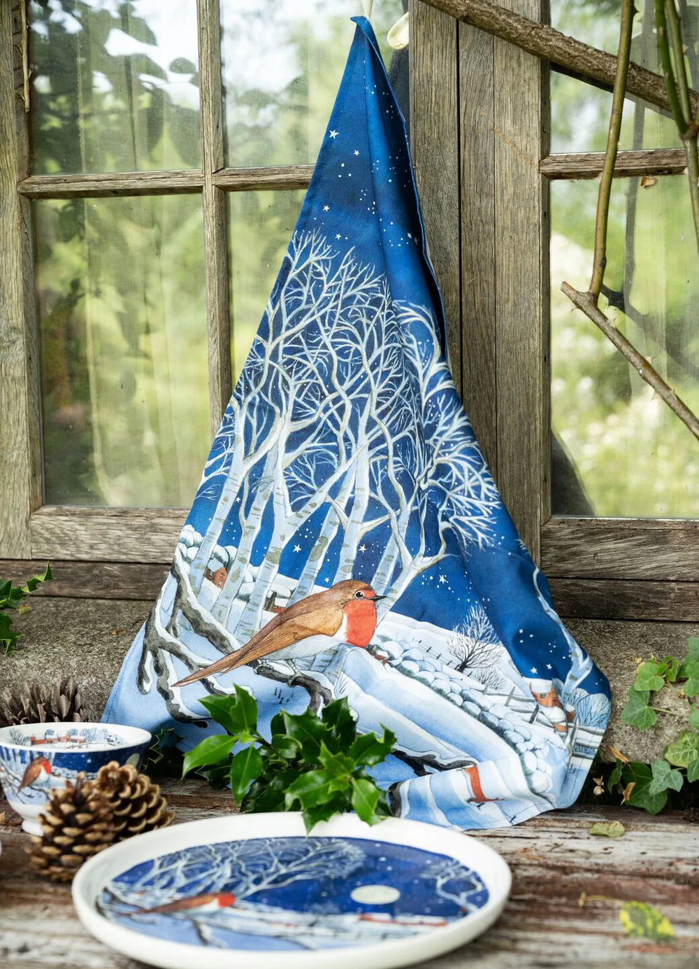 Emma Bridgewater Midnight Robin Christmas tea towel featuring a festive robin bird illustration on soft fabric.