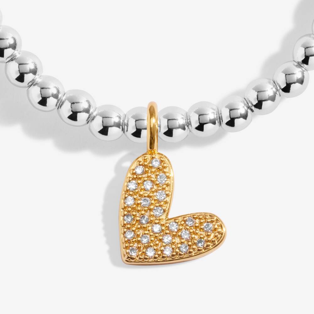 Joma Jewellery "A Little Love You To Bits" bracelet with delicate charm, stylish jewelry accessory on a neutral background