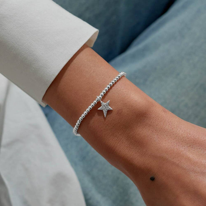 Joma Jewellery "A Little Forever Proud of You" bracelet with a delicate silver chain and charm, perfect for gifting.