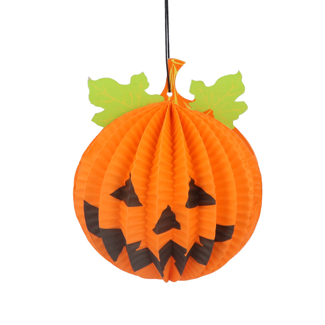 Orange paper honeycomb pumpkin face with leaves, festive Gisela Graham Halloween decoration by Cornucopia Home and Gift.