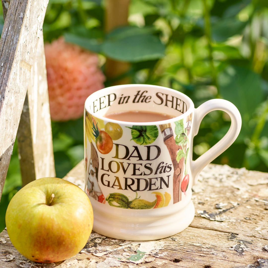 Emma Bridgewater Dad Loves His Garden ½ Pint Mug with garden-themed design, white ceramic cup featuring colorful illustration.