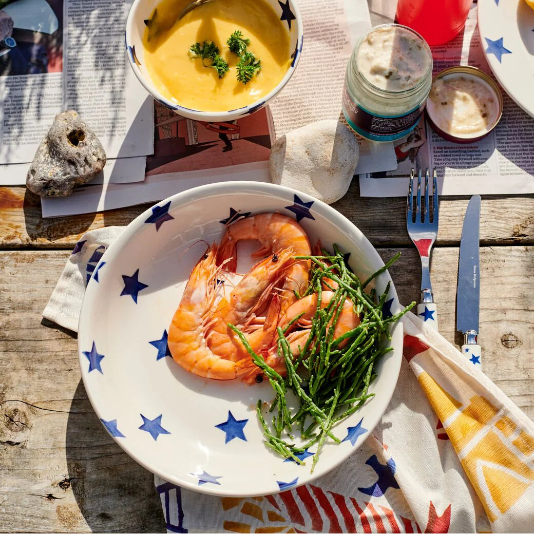 Emma Bridgewater Blue Star medium pasta bowl with a white background and blue star pattern, showcasing its smooth ceramic surface.