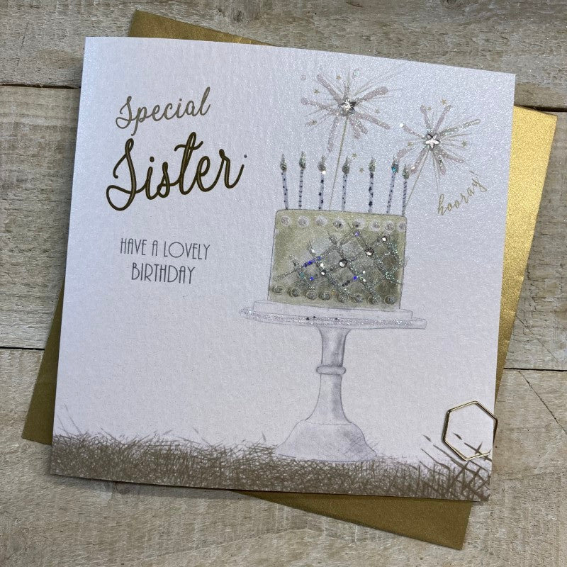 White cotton birthday card for sisters from Cornucopia Home and Gift, featuring a simple, elegant design on a clean background.