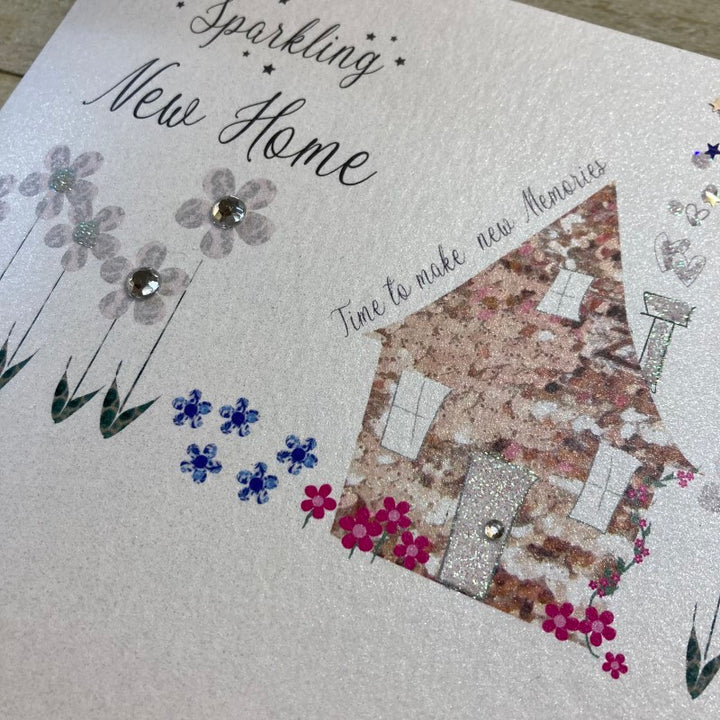 White cotton "Sparkling New Home" greeting card by Cornucopia Home and Gift from White Cotton Cards Ltd, featuring elegant design.