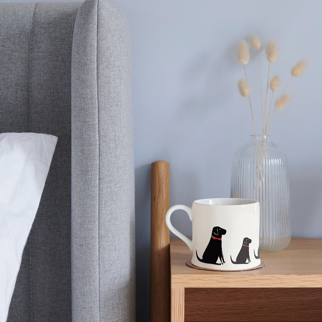 Black Labrador dog mug by Sweet William featuring a cute Labrador illustration, ideal for dog lovers.