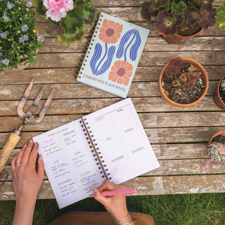 A5 Gardening hardcover journal by Cornucopia Home and Gift featuring a floral bloom design and garden-themed details.