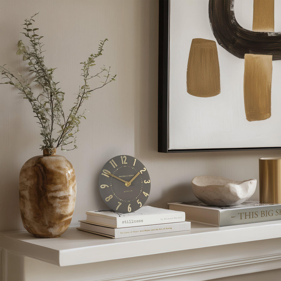 Art Marketing Mulberry mantel clock in espresso finish, showcasing a vintage-inspired design with a round face and decorative details.