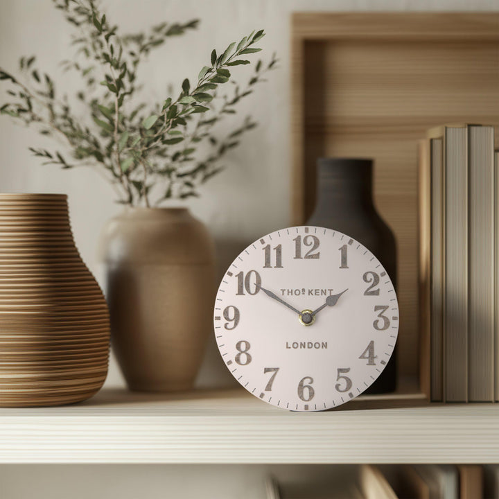 Shy pink 6-foot Arabic mantel clock by Cornucopia Home and Gift, featuring intricate Arabic design and decorative art style.