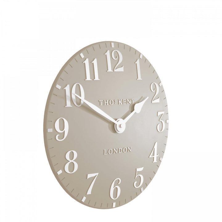 12-foot Arabic wall clock in sandy tones by Cornucopia Home and Gift, featuring intricate Arabic design and artistic craftsmanship.