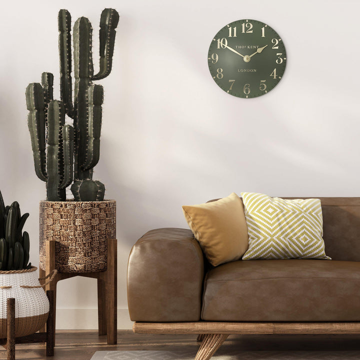 Lichen green 12-foot Arabic wall clock by Cornucopia Home and Gift, featuring bold Arabic numerals and a modern design.