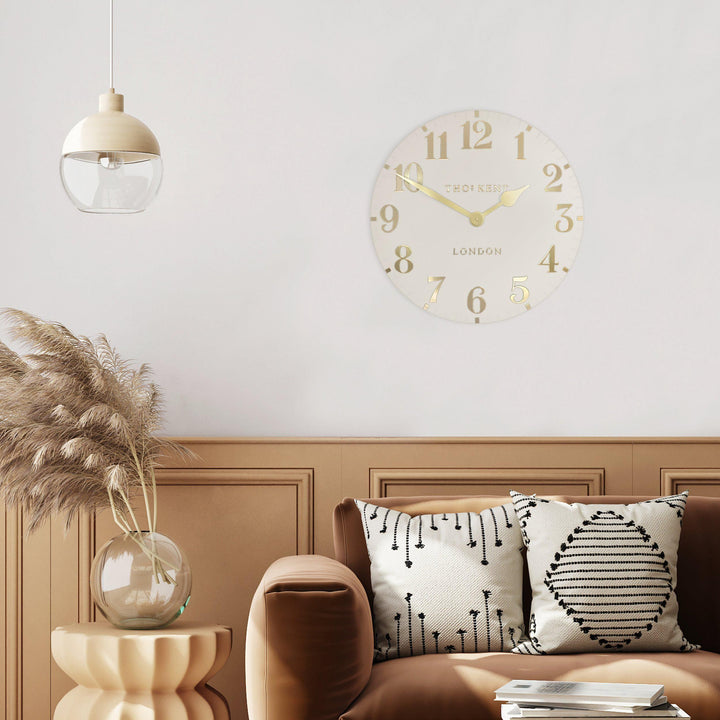 12-inch Arabic wall clock in oatmeal color by Cornucopia Home and Gift, featuring a stylish and functional design for home decor.
