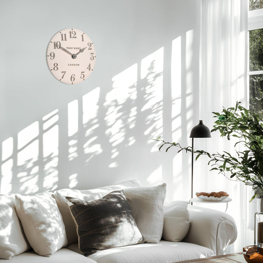 12-foot pink Arabic wall clock by Cornucopia Home and Gift featuring bold, modern design and colorful Arabic numerals.