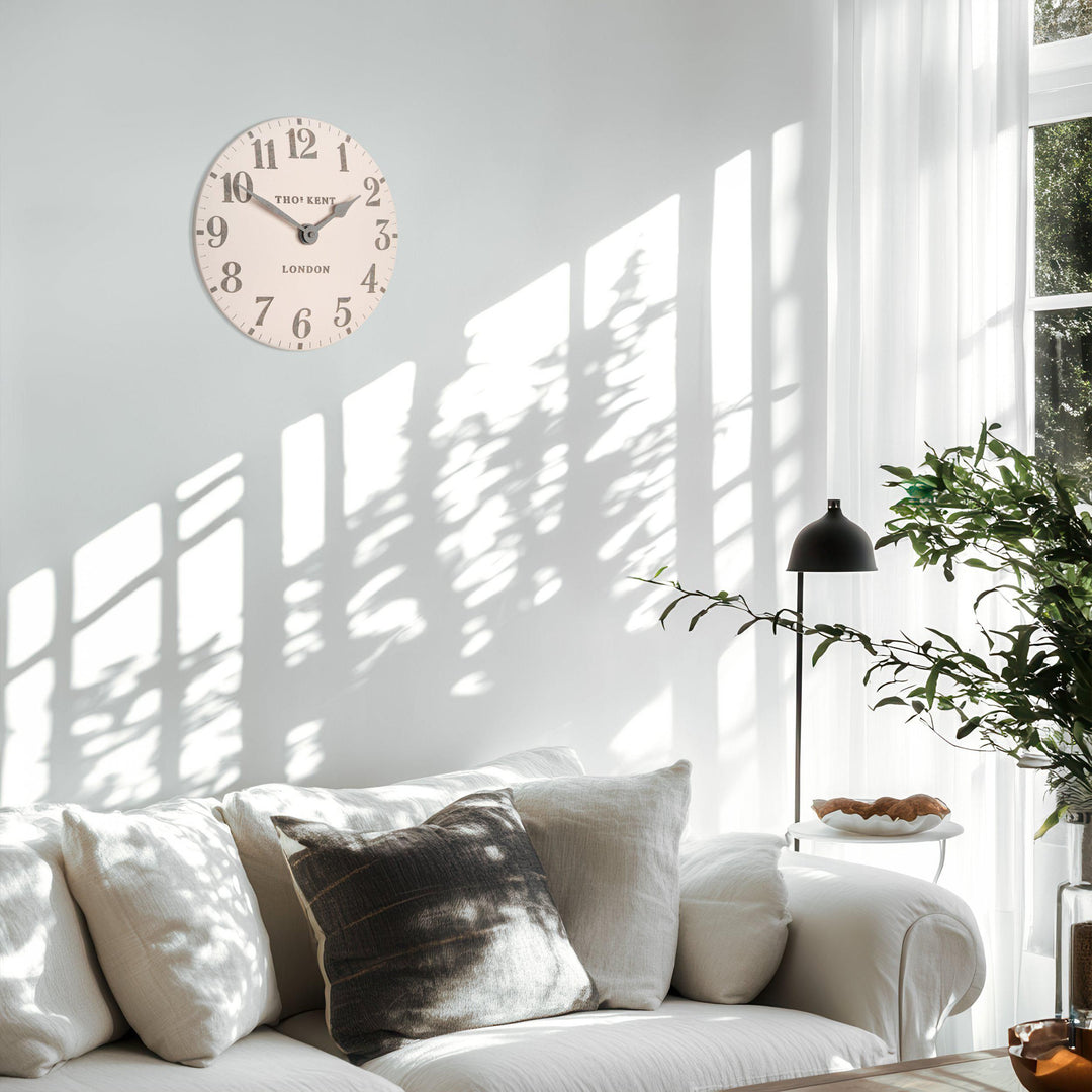 12-foot pink Arabic wall clock by Cornucopia Home and Gift featuring bold, modern design and colorful Arabic numerals.