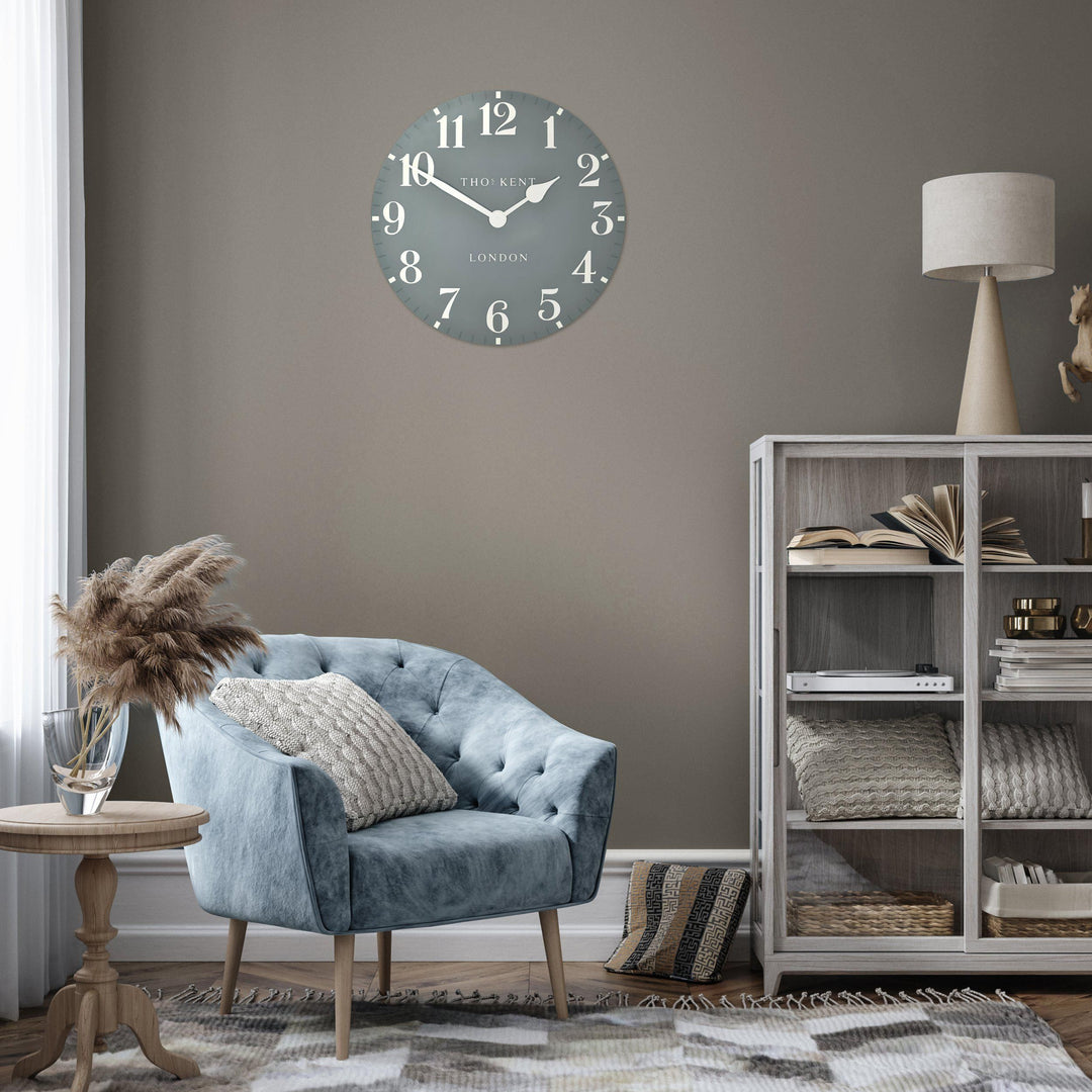 20-inch Arabic wall clock with a blue flax design by Cornucopia Home and Gift, featuring bold Arabic numerals and a stylish frame.