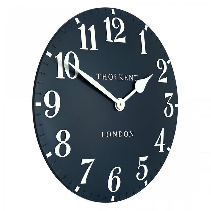 Large 20-inch Arabic ink wall clock with bold black numerals, artistic design, by Cornucopia Home and Gift.