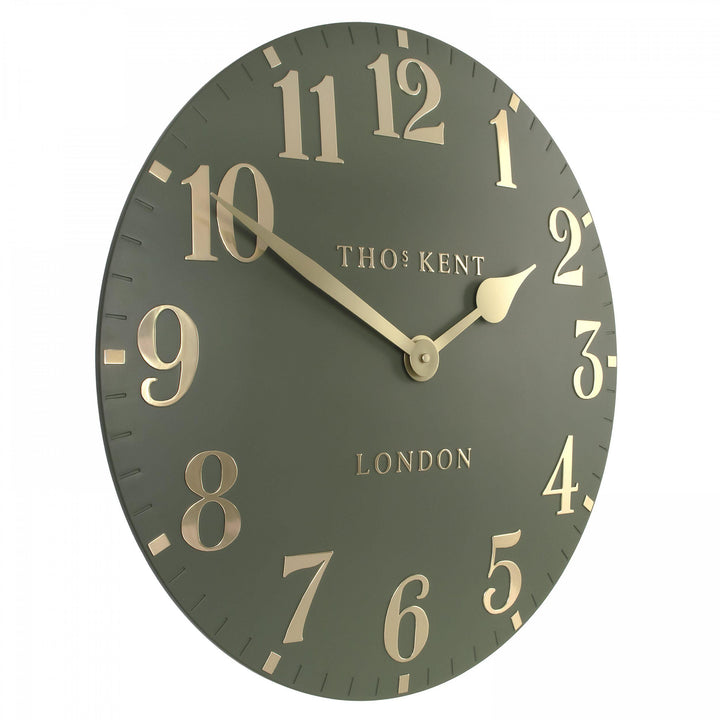 20-inch Arabic Lichen Green wall clock by Cornucopia Home and Gift featuring a modern design and Arabic numerals on a vibrant green background.