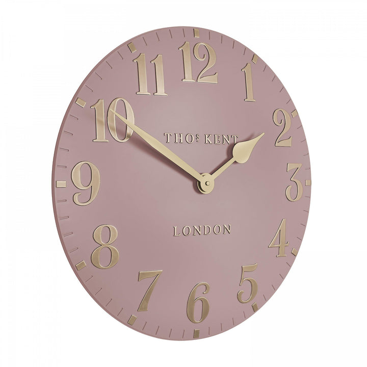 20-inch blush pink Arabic wall clock by Cornucopia Home and Gift featuring bold black Arabic numerals and sleek modern design