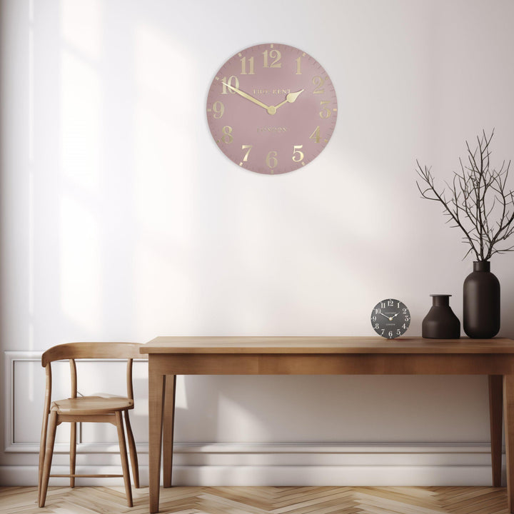 Pink 20-inch Arabic wall clock by Cornucopia Home and Gift, featuring elegant Arabic numerals and a stylish blush pink finish.