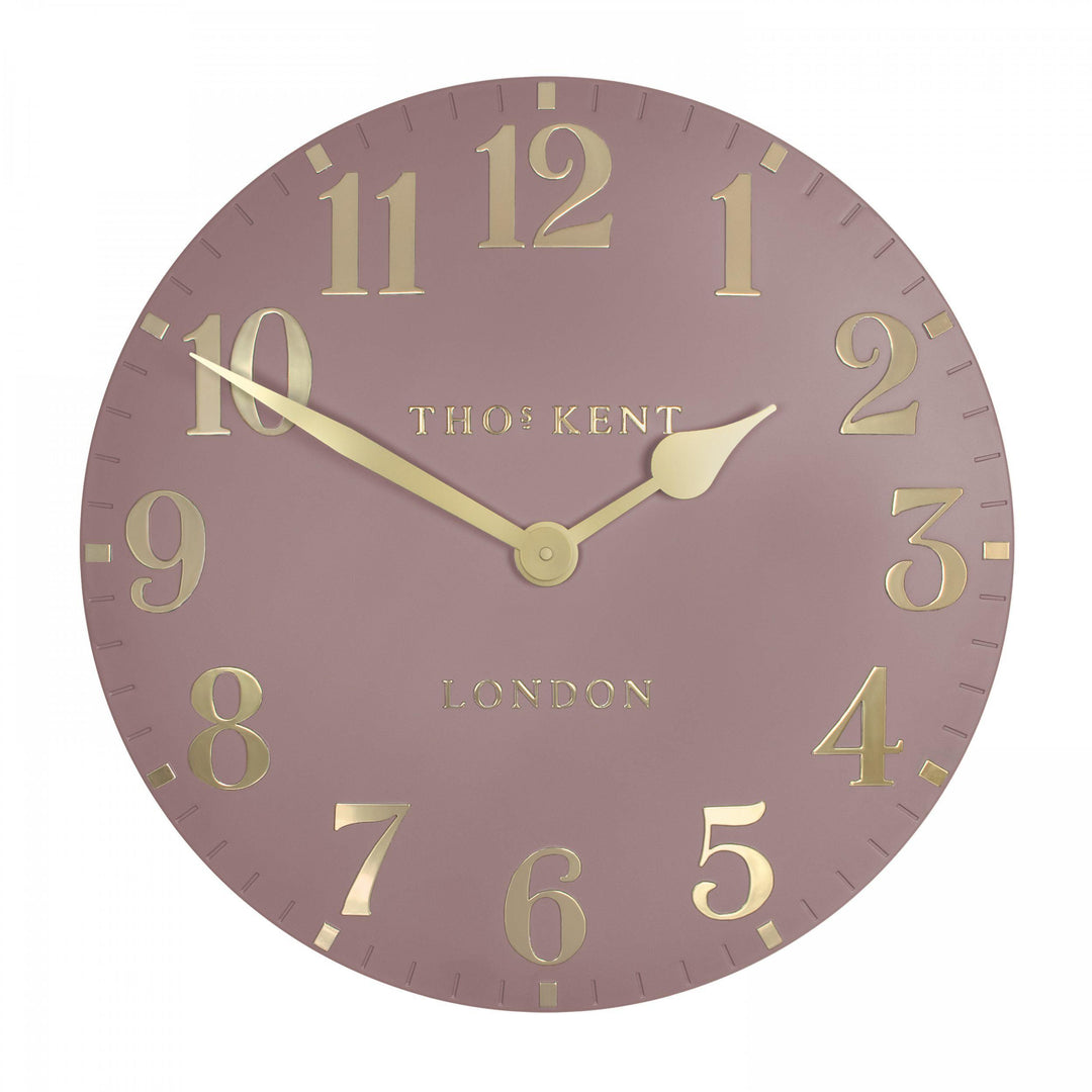 20-inch blush pink Arabic wall clock by Cornucopia Home and Gift, featuring elegant Arabic numerals and a stylish design.