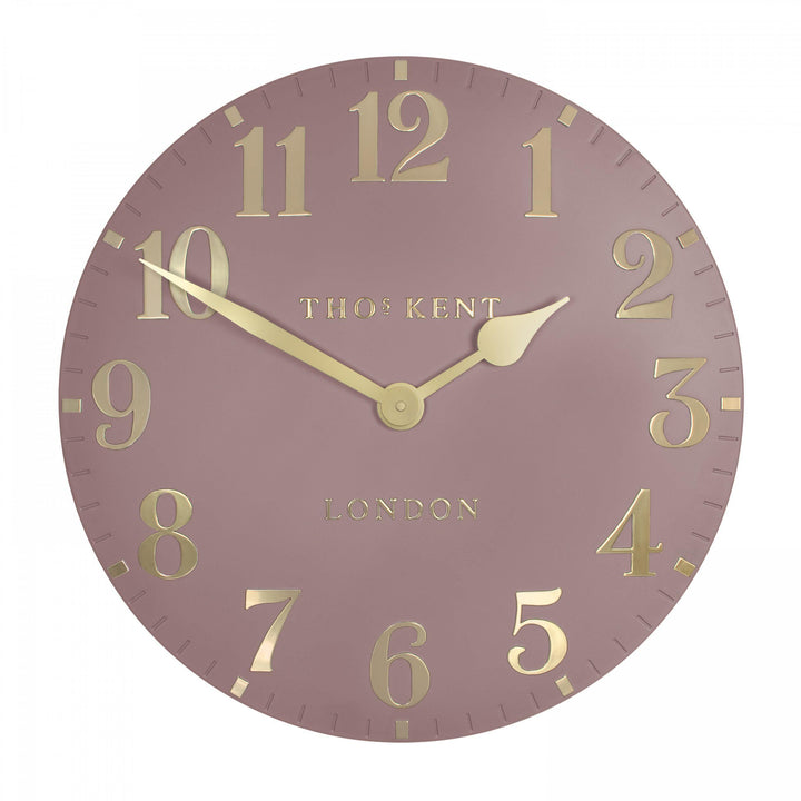 20-inch blush pink Arabic wall clock by Cornucopia Home and Gift, featuring elegant Arabic numerals and a stylish design.