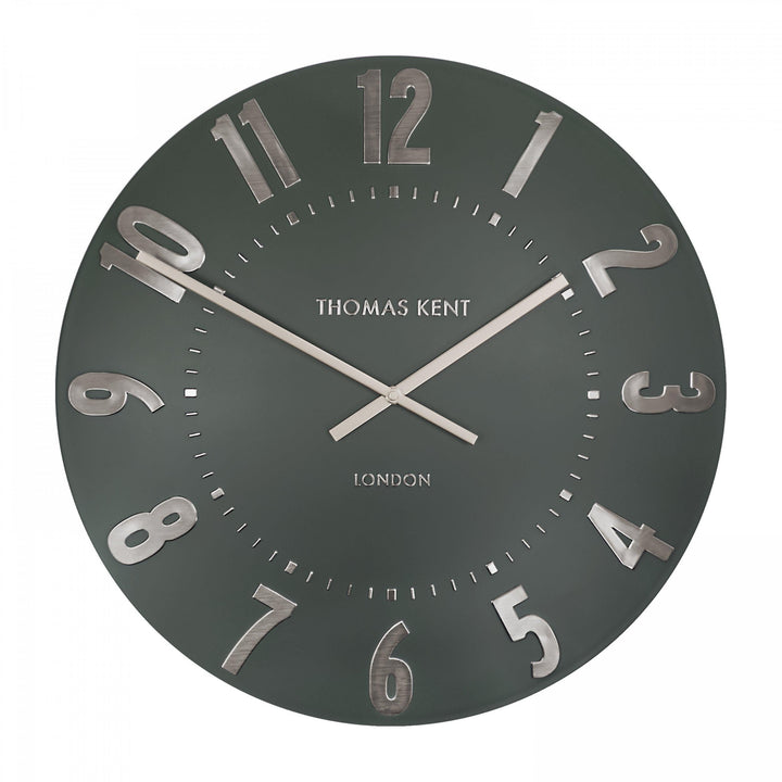 Olive green 20-inch Arabic wall clock by Cornucopia Home and Gift with black numerals and modern design.
