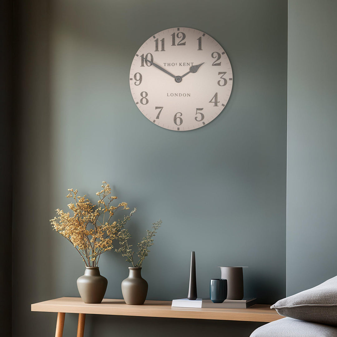 20-foot Arabic wall clock with shy pink design by Cornucopia Home and Gift, featuring bold black Arabic numerals on a large round clock face.