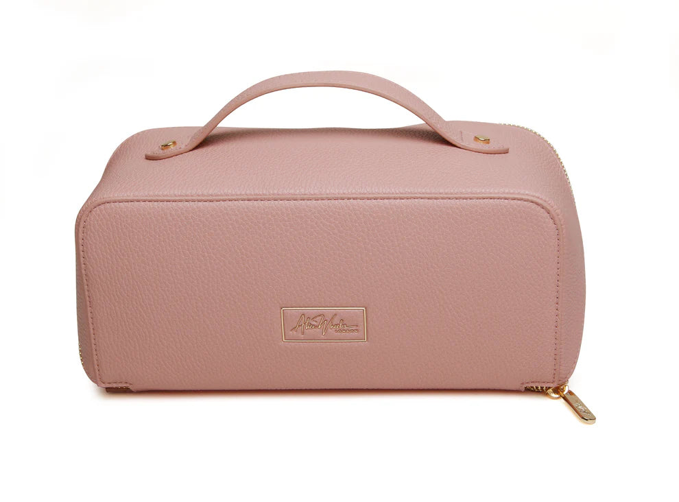 Pink Alice Wheeler train case with handle and zip closure, featuring a compact, stylish design for travel and organization.