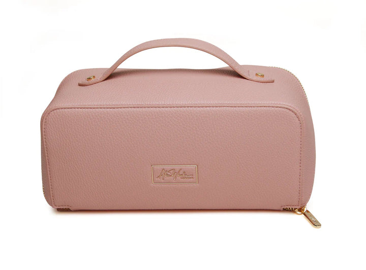 Pink Alice Wheeler train case with handle and zip closure, featuring a compact, stylish design for travel and organization.