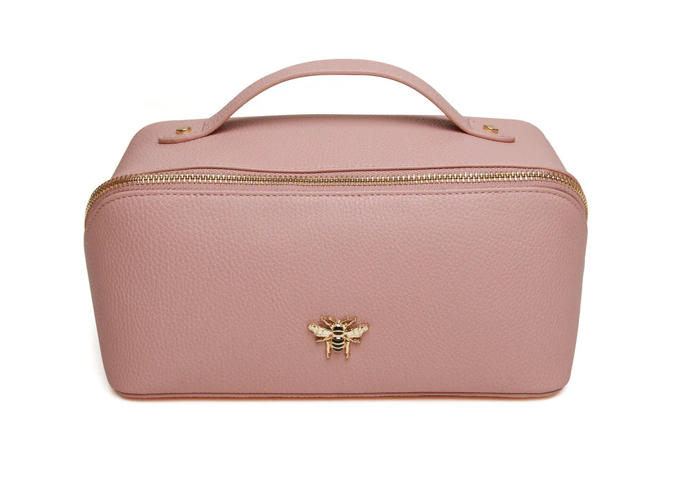 Pink Alice Wheeler train case with handle and zipper, featuring a compact, stylish design ideal for travel or organization.