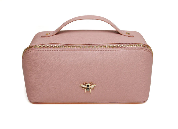 Pink Alice Wheeler train case with handle and zipper, featuring a compact, stylish design ideal for travel or organization.