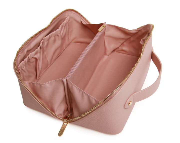 Open pink Alice Wheeler train case with multiple compartments, sturdy handle, and secure latches for travel and organization.
