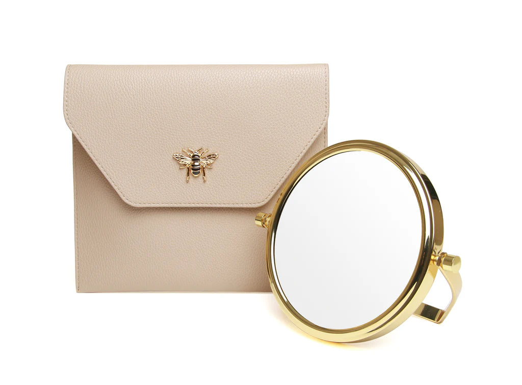 Alice Wheeler travel mirror with stone case, compact and stylish for on-the-go grooming and reflection.