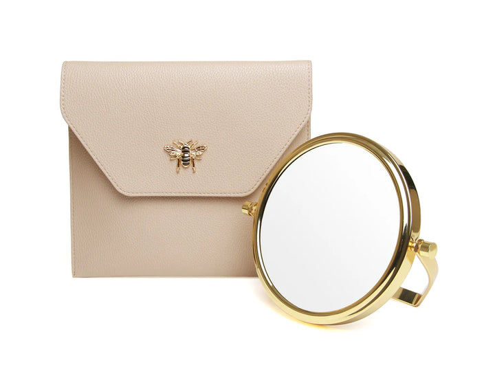 Alice Wheeler travel mirror with stone case, compact and stylish for on-the-go grooming and reflection.