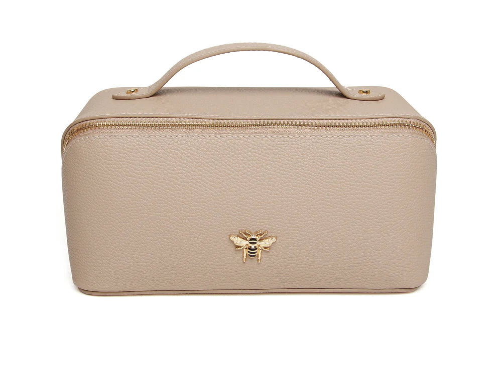 Alice Wheeler Stone Mini Train Case showing compact, stylish luggage with a stone pattern and secure zipper closure.