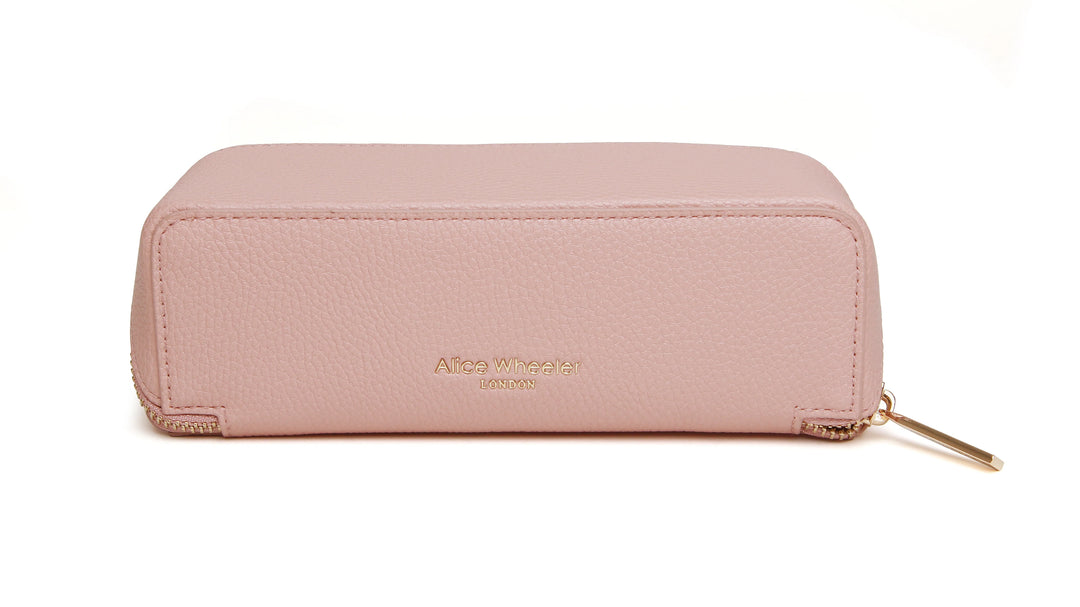 Pink small train case by Alice Wheeler featuring a compact, stylish design with a handle and secure clasps.
