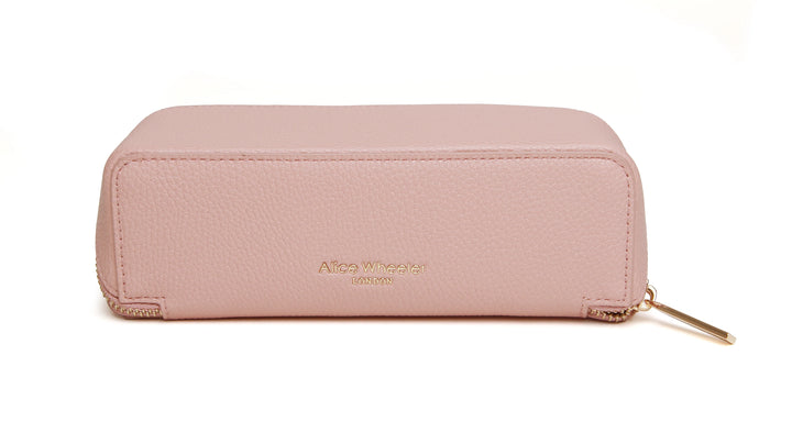 Pink small train case by Alice Wheeler featuring a compact, stylish design with a handle and secure clasps.